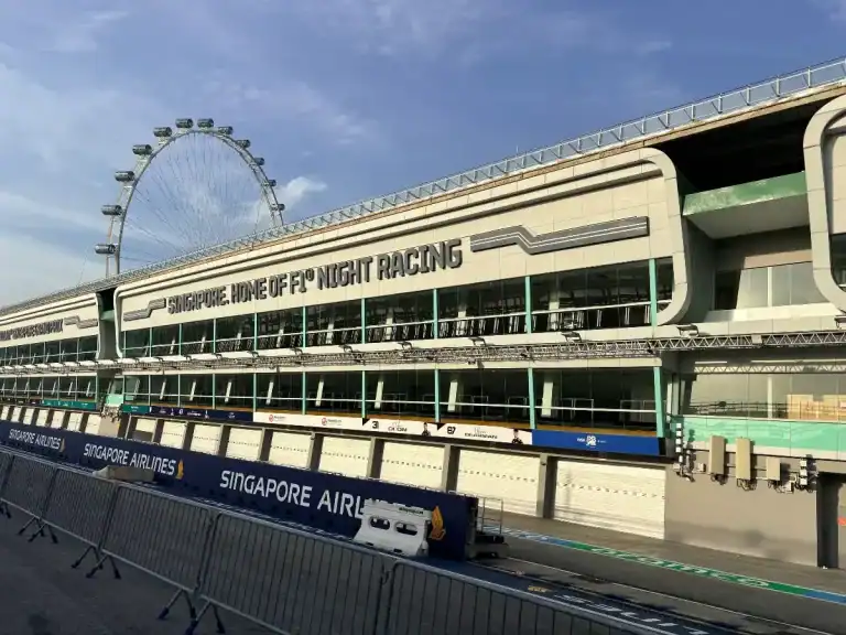 Kallang Riverside Park to MBS : with a pit stop at F1 1 Singapore Formula 1 pit building with the Singapore Flyer in the background. "Singapore. Home of F1 Night Racing" text visible.